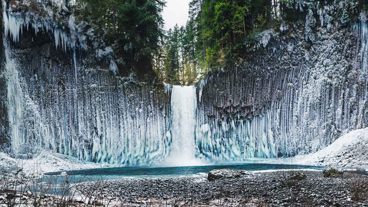 Ice sticking to the columnar basalt walls surrounding Abiqua Falls, Oregon, USA (© Joshua Meador/Tandem Stills + Motion)