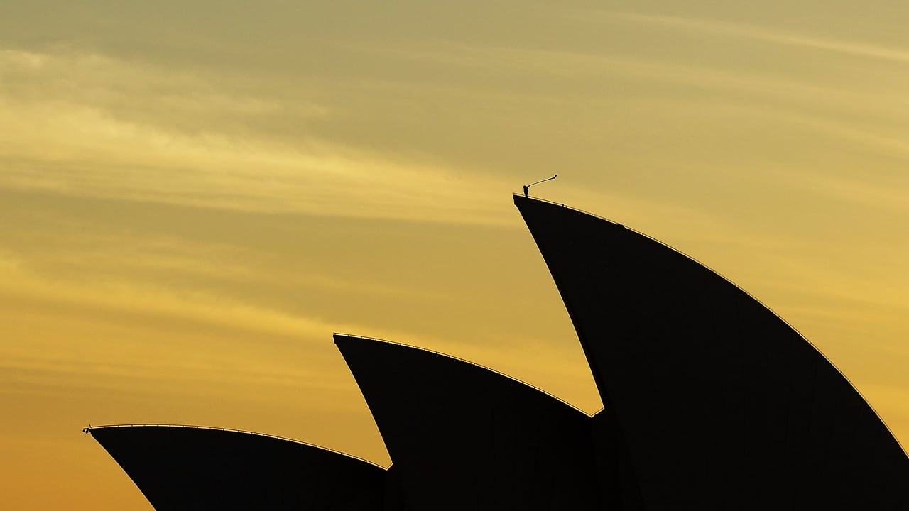 Arkady Shilkloper plays his three-metre-long alphorn atop the Sydney Opera House as part of the 2013 Sydney Festival (© Mark Metcalfe/Getty Images)