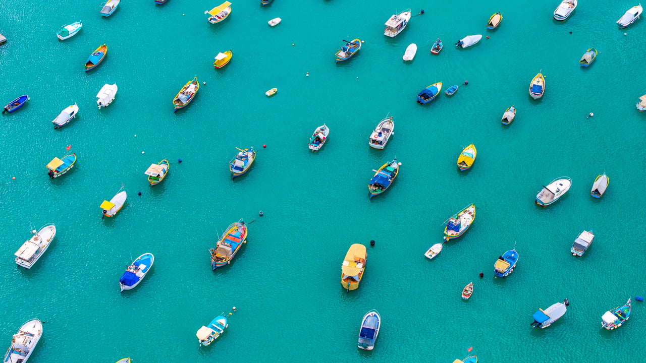Colorful boats in Marsaxlokk Harbor, Malta (© Klubovy/Getty Images)