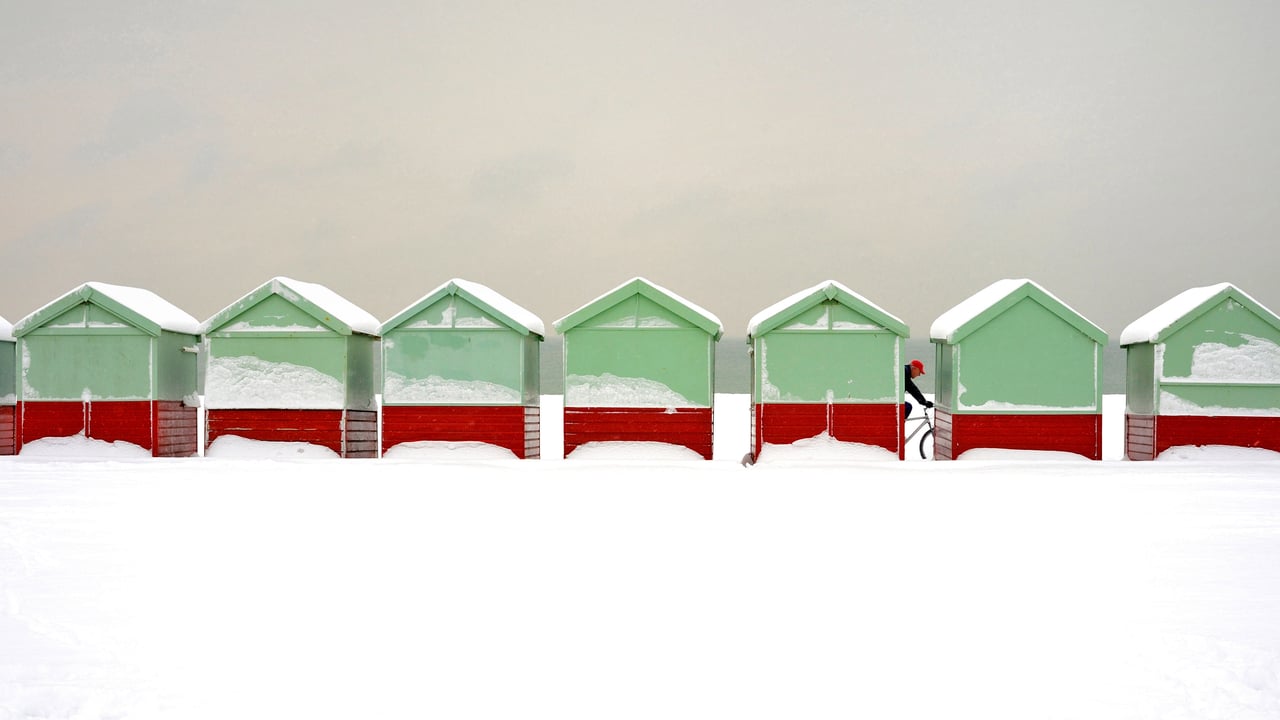 Beach huts covered in snow in Brighton and Hove, England (© Tim Jones/Alamy)