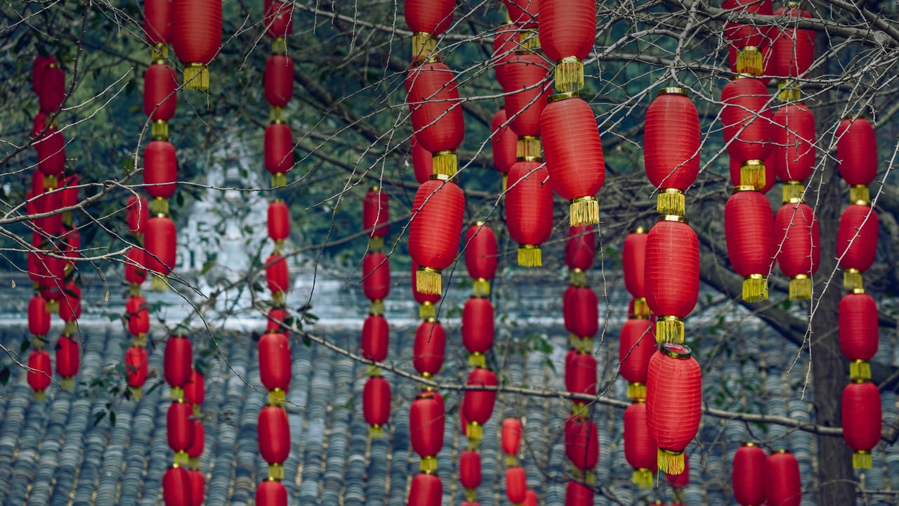 Red lanterns hanging on trees during the Lantern Festival in Chengdu, Sichuan, China (© Philippe Lejeanvre/Getty Images)