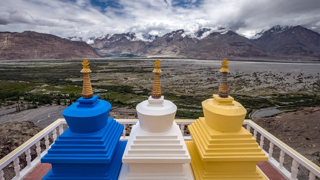 Three stupa with Nubra Valley in the background in Ladakh, India (© Puripat Lertpunyaroj/Getty Images)