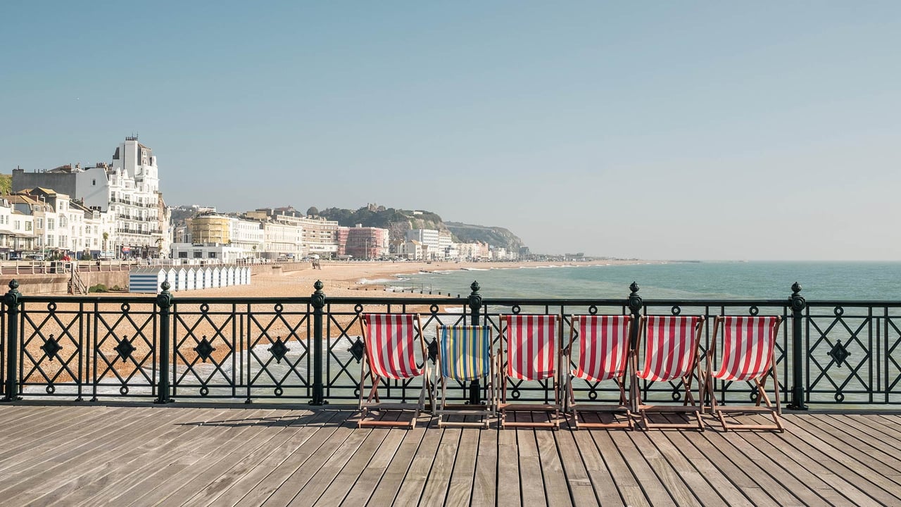 Deckchairs on Hastings Pier, East Sussex, England (© ams images/Alamy)