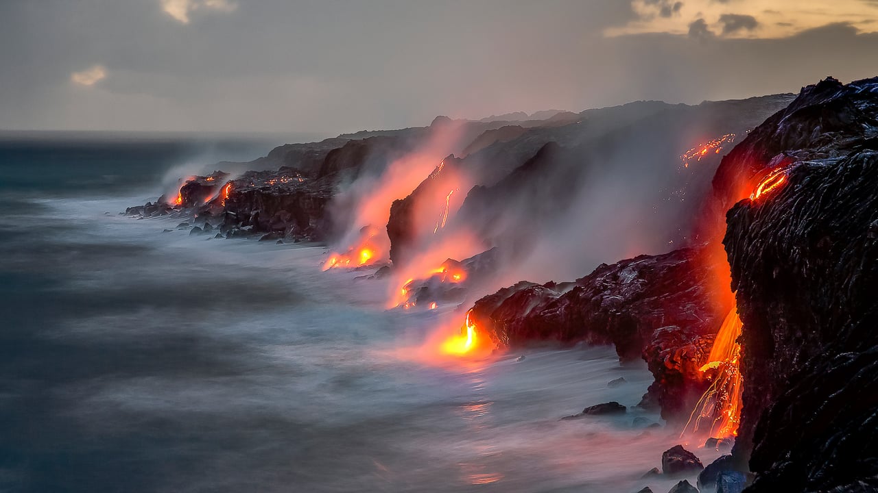 A series of lava flows spill into the ocean, Big Island, Hawaii (© Ken McCurdy/Getty Images)