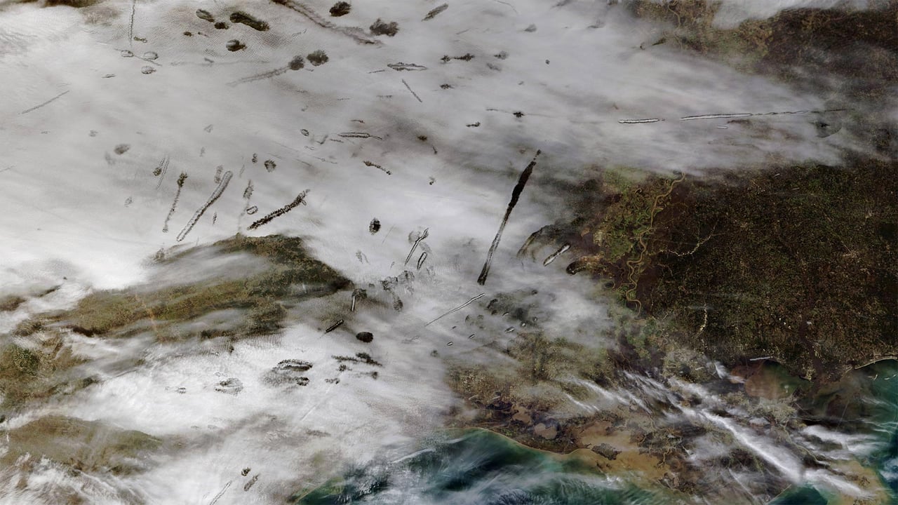 From NASA’s Terra satellite, an image of fallstreak holes in clouds over the southern United States (© NASA)