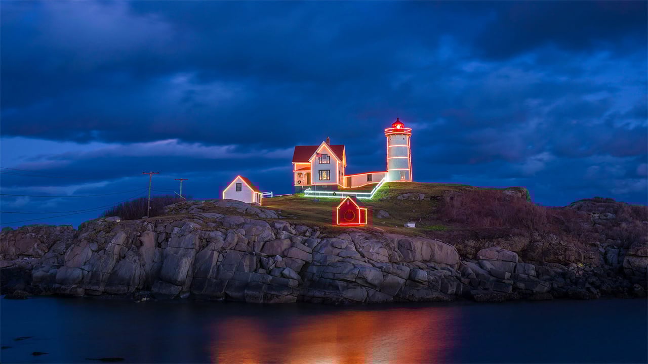Holiday lights on Cape Neddick Light in York, Maine (© Walter Bibikow/Alamy)