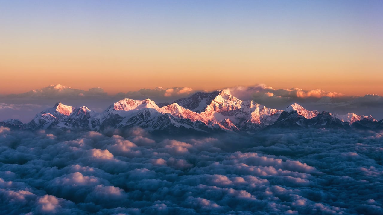 Kanchenjunga, on the India-Nepal border, among a sea of clouds at sunrise (© Alexander W Helin/Getty Images)