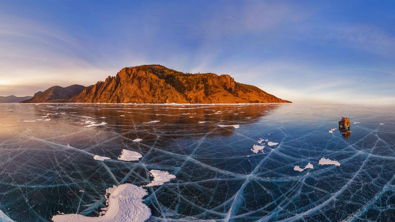 Aerial view of car crossing over the frozen surface of Lake Baikal, Russia (© Amazing Aerial Agency/Offset)