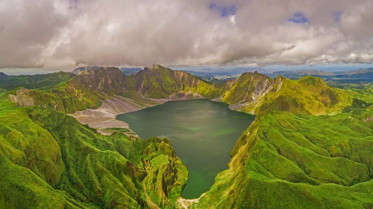 Aerial view of volcanic Lake Pinatubo and mountains, Luzon, Philippines (© Amazing Aerial Agency/Offset by Shutterstock)