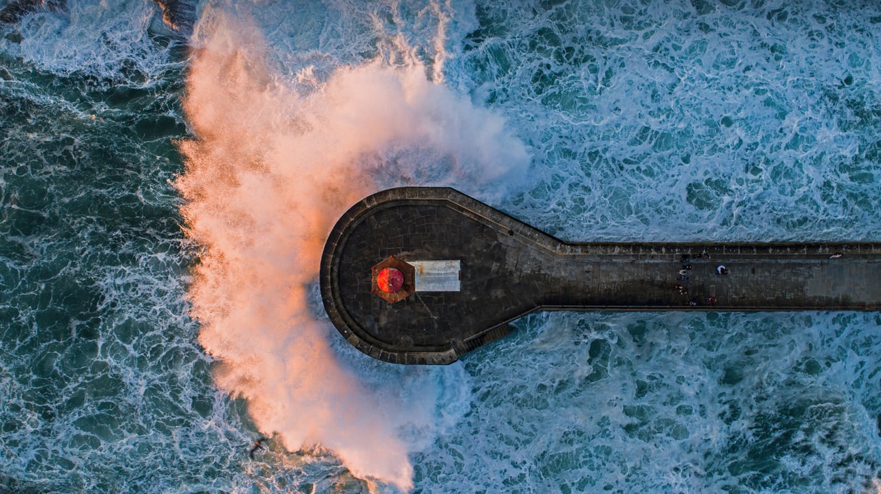 Wave crashing on Farolim de Felgueiras, a lighthouse in Porto, Portugal (© Stephan Zirwes/Offset by Shutterstock)