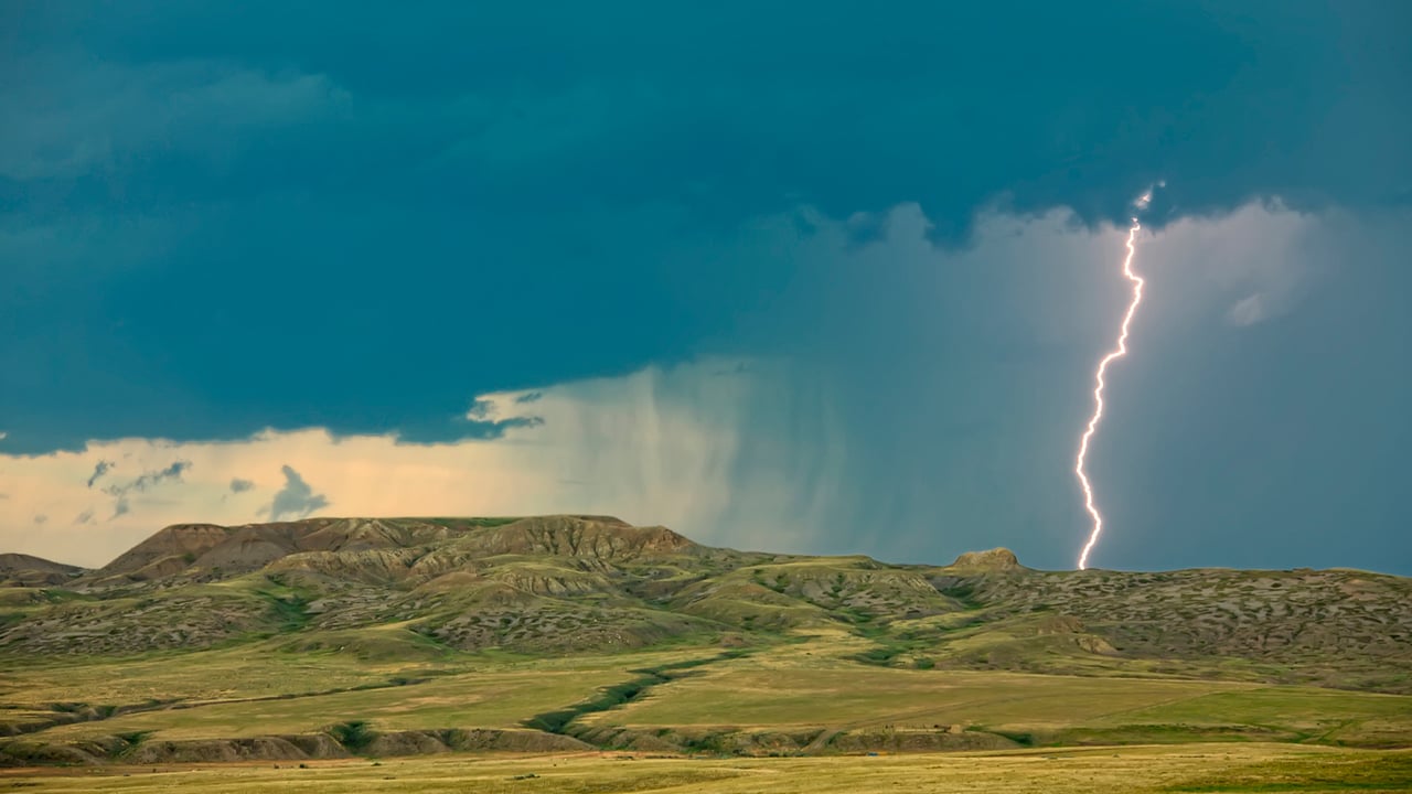 Lightning striking over 70 Mile Butte and Sleeping Lion Butte, Grasslands National Park, Saskatchewan (© Design Pics/DanitaDelimont.com)