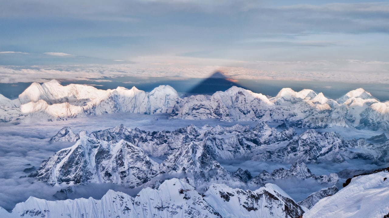 The shadow of Mount Everest over the western Himalayas in Nepal (© Kent Karvey/KH Films, Inc./Tandem Stills + Motion)