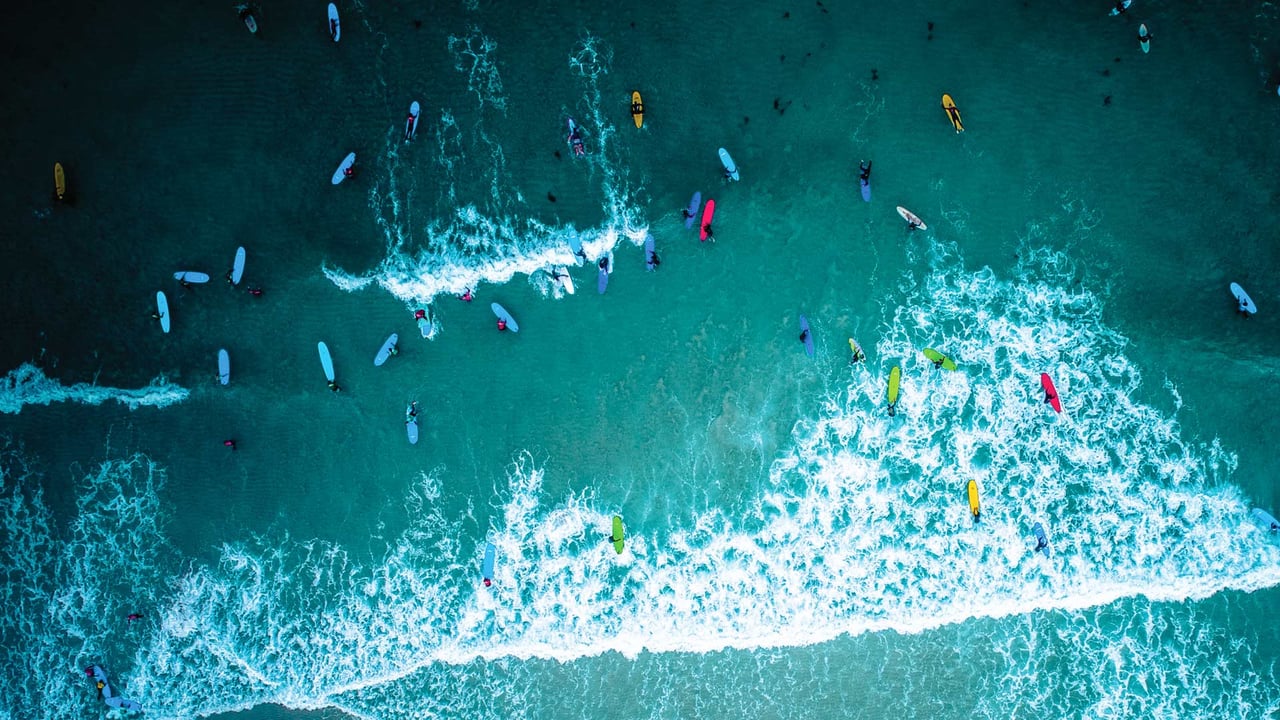 Aerial view of surfers in Cornwall for International Surfing Day (© Matt Cooper/Gallery Stock)