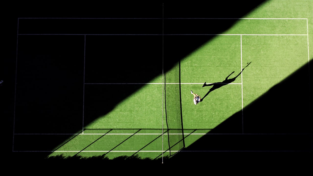 An aerial shot of a tennis match for the opening day of the 2019 Wimbledon Championships (© Kolbz/E+/Getty Images)