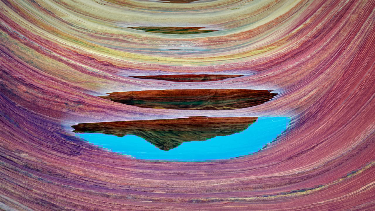 Sandstone formation and pools of water in The Wave, Paria Canyon-Vermillion Cliffs National Monument, Arizona, USA (© Dennis Frates/Alamy)
