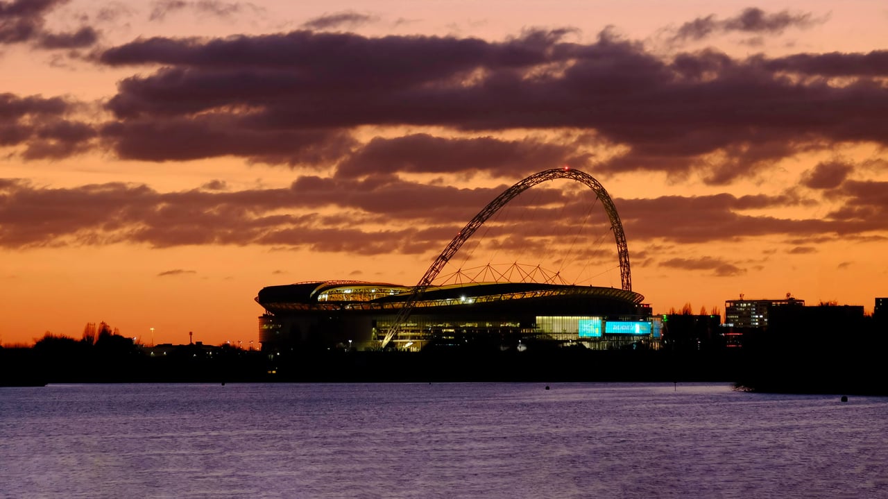 Wembley Stadium at sunset, London (© Charles Bowman/Alamy)