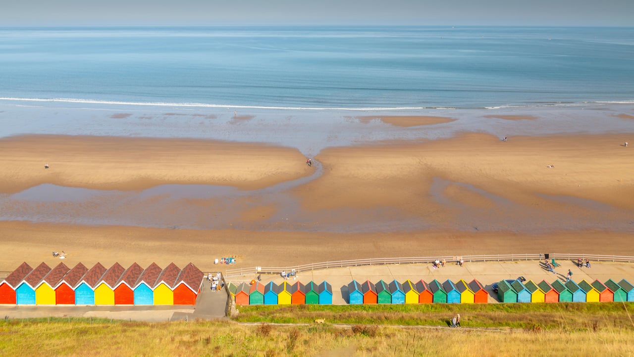 Beach huts on West Cliff Beach, Whitby, North Yorkshire (© Robert Harding World Imagery/Offset)