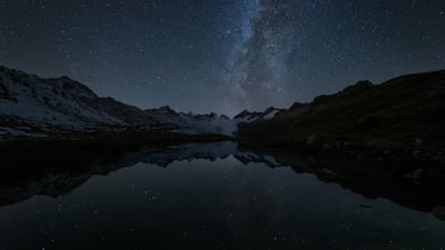 Bing wallpaper August 23, 2020. Stars reflected in the Totensee, a mountain lake at Grimsel Pass, Switzerland (© magodevita/Getty Images)