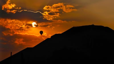 Bing wallpaper March 12, 2021. A balloon flies over the Pyramid of the Sun at sunrise in Teotihuacan, Mexico (© Marco Ugarte/AP Photo)