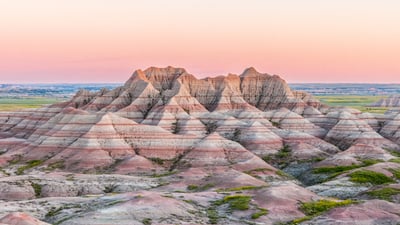 Bing wallpaper June 13, 2026. Sunset in Badlands National Park, South Dakota, USA (© Troy Harrison/Getty Images)