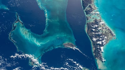 Bing wallpaper April 4, 2024. The Bahamas photographed from the International Space Station (© NASA)