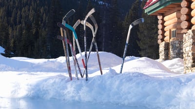 Bing wallpaper January 9, 2020. Ice hockey sticks in snow, Banff, Alta. (© Ascent/PKS Media Inc./Getty Images)