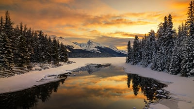 Bing wallpaper February 16, 2026. Scenic view of lake by snowcapped mountains in Banff, Alberta (© Herbert Rong/Getty Images)