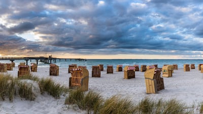 Bing wallpaper April 23, 2025. Beach chairs on Steinwarder in Heiligenhafen, Schleswig-Holstein, Germany (© Frank Lukasseck/eStock Photo)