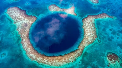 Bing wallpaper February 18, 2025. Great Blue Hole, Belize (© JamiesOnAMission/Shutterstock)