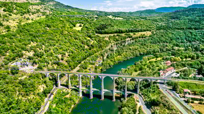 Bing wallpaper July 5, 2025. Cize-Bolozon viaduct crossing the Ain gorge, France (© Leonid Andronov/Getty Images)