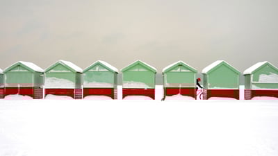 Bing wallpaper January 14, 2021. Beach huts covered in snow in Brighton and Hove, England (© Tim Jones/Alamy)