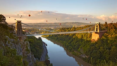 Bing wallpaper August 8, 2024. Clifton Suspension Bridge during the Bristol Balloon Fiesta, Bristol (© robertharding/Adobe Stock)