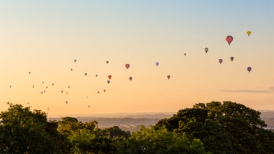 Bing wallpaper August 6, 2026. Hot air balloons above Bristol city centre, England (© Rich Jones Photography/Moment/Getty Images)