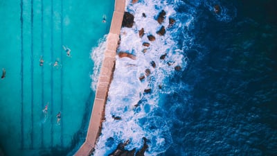 Bing wallpaper March 7, 2020. Bird's-eye view of Bronte Baths ocean pool outside Sydney, Australia (© Shay Cooper/Media Drum World/Cavan Images)