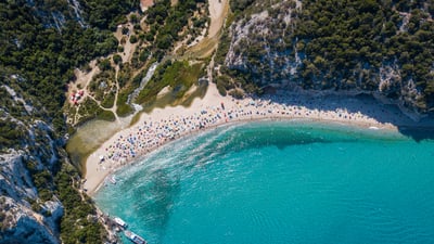 Bing wallpaper June 4, 2025. The beach at Cala Luna, Sardinia, Italy (© guenterguni/Getty Images)