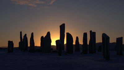 Bing wallpaper December 22, 2019. The Callanish Stones, Isle of Lewis, at sunset (© Neil MacConnell/Alamy Stock Photo)