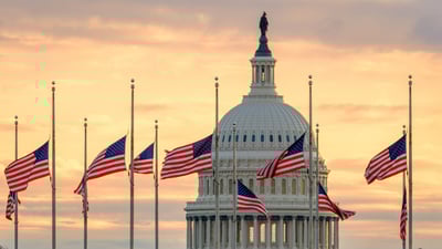 Bing wallpaper January 9, 2025. The US Capitol dome with flags flying at half-staff in honor of former President Jimmy Carter, Washington, DC (© J. David Ake/Getty Images)