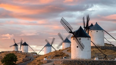 Bing wallpaper June 4, 2026. Molinos de Consuegra al amanecer, Castilla-La Mancha (© Paulo Costa/Getty Images)