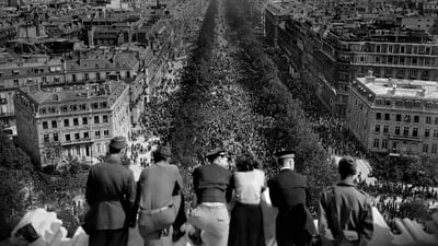 Bing wallpaper May 8, 2020. People looking at the crowded Avenue des Champs-Élysées from the Arc de Triomphe on May 8, 1945, Paris, France (© AFP via Getty Images)