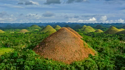 Bing wallpaper November 24, 2021. Chocolate Hills in Bohol, Philippines (© Danita Delimont/Offset by Shutterstock)