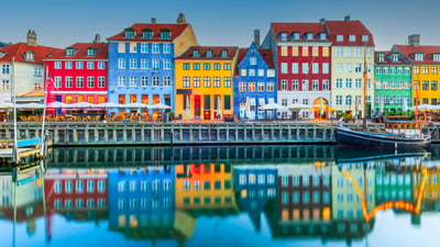Bing wallpaper August 11, 2026. Colorful homes line Nyhavn Canal, Copenhagen, Denmark (© emicristea/Getty Images)