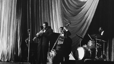 Bing wallpaper April 30, 2025. Jazz saxophonist John Coltrane and band performing in 1961 in London, England (© Popperfoto/Getty Images)