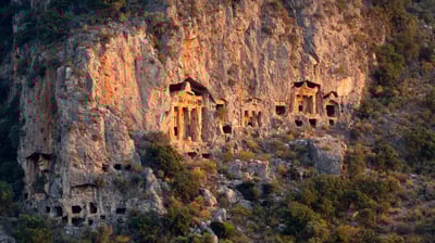 Bing wallpaper November 9, 2021. Ancient rock tombs carved into the cliff near Dalyan, Turkey (© Reinhard Schmid/eStock Photo)
