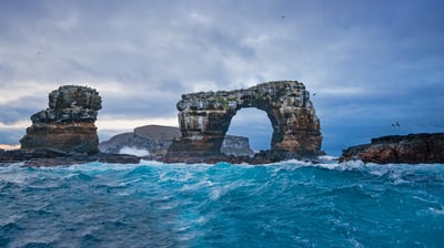 Bing wallpaper February 12, 2022. Darwin's Arch with Darwin Island in background, Galápagos, Ecuador (© miralex/Getty Images)