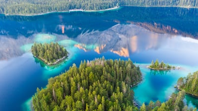 Bing wallpaper March 12, 2021. The Zugspitze mountain reflecting in Eibsee lake, Bavaria, Germany (© Martin Siepmann/Westend61/Offset by Shutterstock)