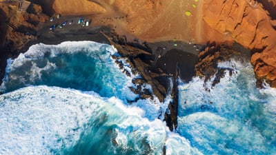 Bing wallpaper September 24, 2026. Aerial view of black lava beach, El Golfo, Lanzarote, Canary Islands, Spain (© Westend61/Adobe Stock)
