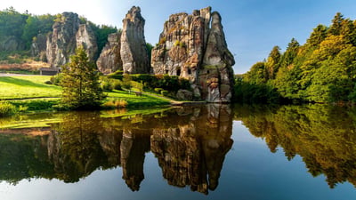 Bing wallpaper August 17, 2024. Externsteine im Teutoburger Wald, Nordrhein-Westfalen (© MoJoLo/Panther Media GmbH/Alamy Stock Photo)