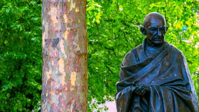 Bing wallpaper October 1, 2024. Statue of Mahatma Gandhi at Parliament Square, Westminster, UK (© cowardlion/Shutterstock)