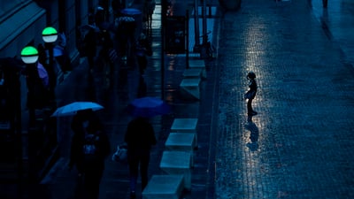 Bing wallpaper March 8, 2025. Fearless Girl statue facing the New York Stock Exchange, New York City (© JOHANNES EISELE/AFP via Getty Images)