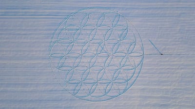 Bing wallpaper March 9, 2022. The 'Flower of Life' symbol drawn in the snow by artist Michael Uy, Jacobsdorf, Brandenburg, Germany (© Patrick Pleul/picture alliance via Getty Images)